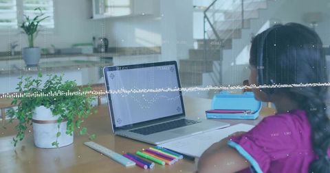 Child Studying with Laptop in Modern Home Dining Area, Focus on Education