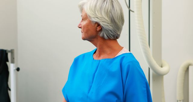 Senior Woman in Hospital Gown Awaiting Medical Examination - Download Free Stock Images Pikwizard.com