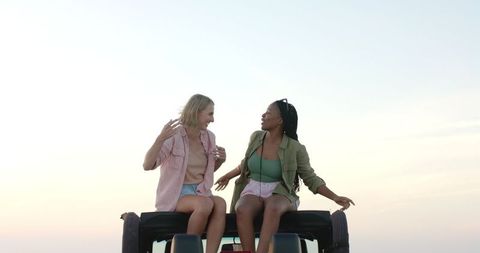 Couple Enjoying Sunset During Road Trip Adventure