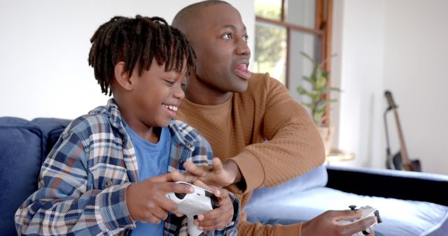 Father and Son Enjoying Video Game Indoors - Download Free Stock Images Pikwizard.com