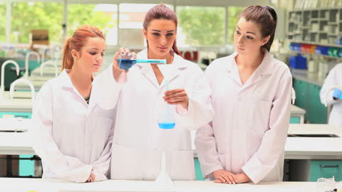 Students Conducting Experiment in Modern Laboratory Atmosphere