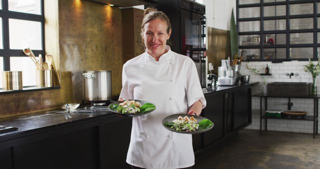 Female Chef Serving Dishes in Modern Industrial Kitchen - Download Free Stock Images Pikwizard.com