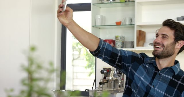 Smiling Man Taking Selfie in Home Kitchen - Download Free Stock Images Pikwizard.com