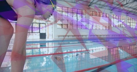Swimmer Preparing for Dive in Modern Competition Pool