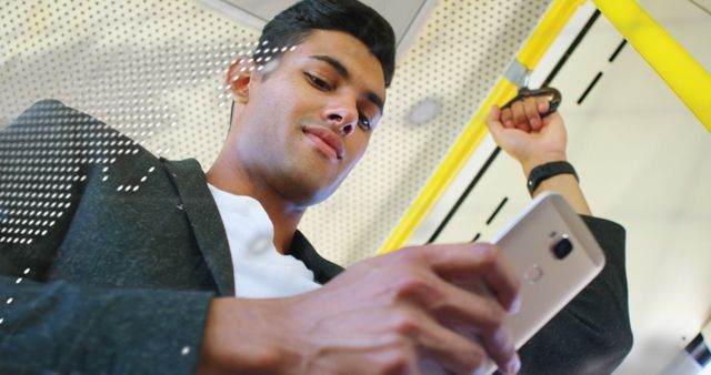 Young Professional Commuting while Using Smartphone in Public Transport - Download Free Stock Images Pikwizard.com