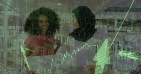 Businesswomen analyzing stock market trends on digital interface