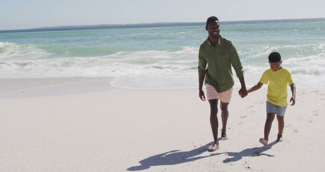 Father and Son Enjoying a Walk on the Beach - Download Free Stock Images Pikwizard.com