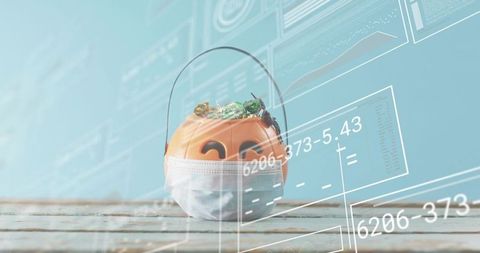 Halloween pumpkin bucket wearing surgical mask on weathered wooden tabletop with candy