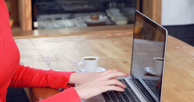 Woman Typing on Laptop at Cafe with Coffee Cup - Download Free Stock Images Pikwizard.com