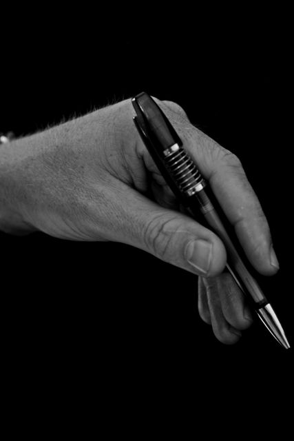 Close-Up of Hand Holding Pen in Artistic Black and White - Download Free Stock Images Pikwizard.com