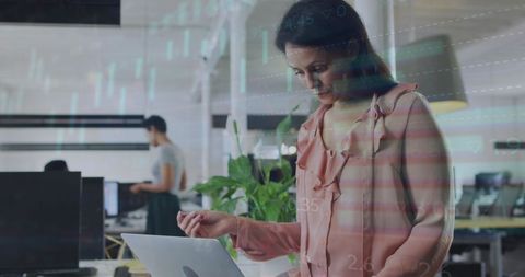 Business Woman Analyzing Digital Financial Data in Modern Office