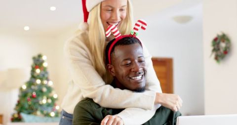 Diverse Couple Celebrating Christmas Together in Cozy Home