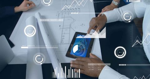 Colleagues Analyzing Data at Office Table with Digital Interface Graphics