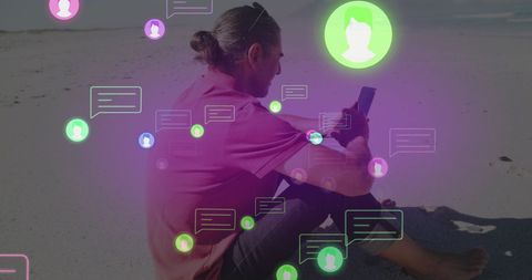 Man engaging in social media networking on beach