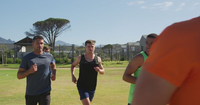 Group of Men Running Outdoors on Sunny Day - Download Free Stock Images Pikwizard.com