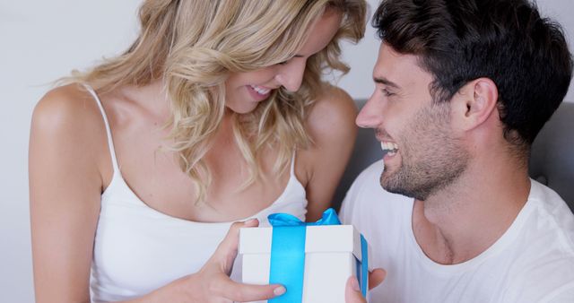 Happiness and Love Surround Couple Exchanging Gift - Download Free Stock Images Pikwizard.com