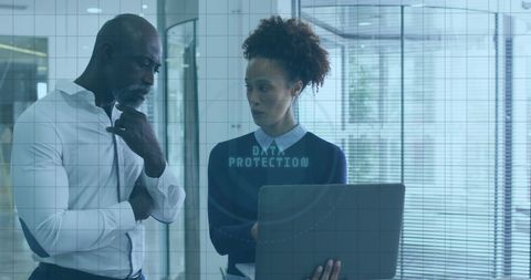 Executives Discussing Data Protection Strategy in Modern Office