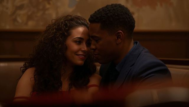 Romantic Couple Engaged in Intimate Conversation at Cozy Diner