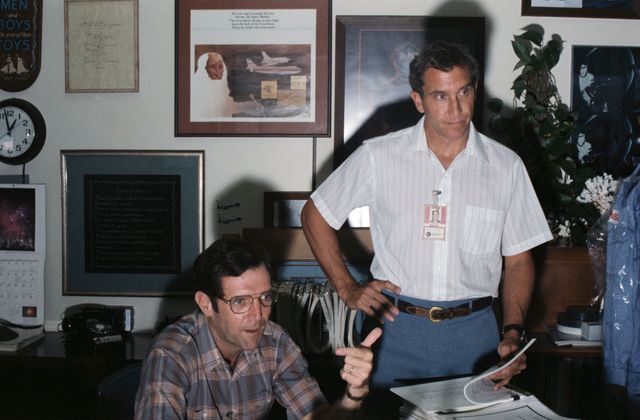 Candid views of the STS-33/51L Crew during study periods in their offices on 09/09/1985. Astronauts Michael J. Smith (right), STS 51L Pilot, and Francis R. (Dick) Scobee, 51L Mission Commander, are photographed in conversation while in training.     JSC, HOUSTON, TX