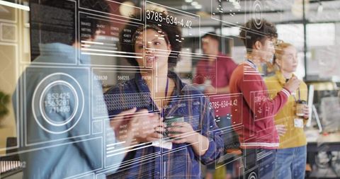 Female Tech Lead Presenting Data Dashboard with Futuristic HUD Overlays in Open Office