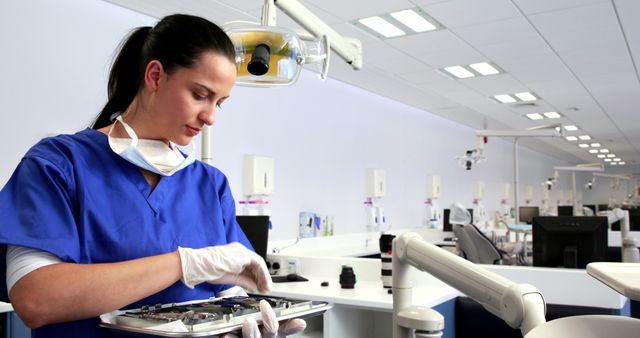 Female Dentist Preparing Sterilized Instruments in Modern Dental Clinic - Download Free Stock Images Pikwizard.com