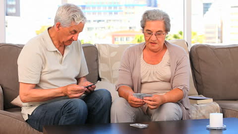 Senior Couple Engaging in Relaxing Card Game at Home