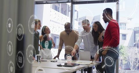 Diverse team collaborating around table with AR overlays, brainstorming business strategy