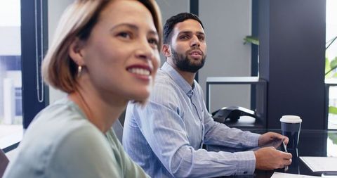 Colleagues collaborating in modern business meeting