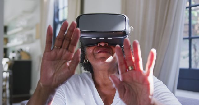 Senior Woman Exploring Virtual Reality - Download Free Stock Images Pikwizard.com