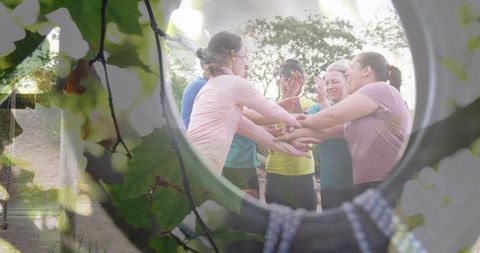 Diverse women teaming up for group fitness