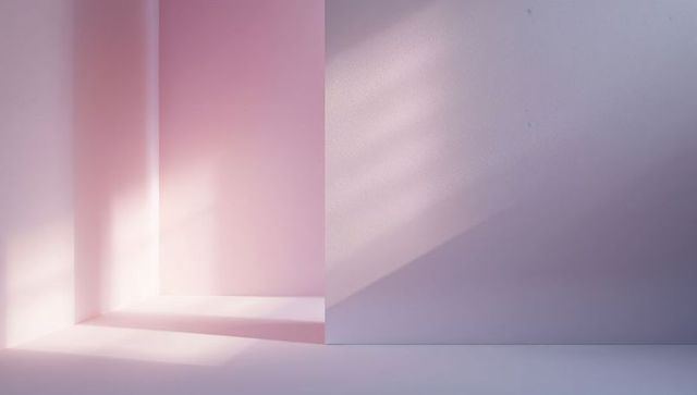 Pastel pink minimalist corner featuring alcove, partition and sunlit geometric shadows