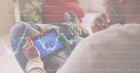 businessman analyzing data on tablet with stock charts overlay - Download Free Stock Images Pikwizard.com
