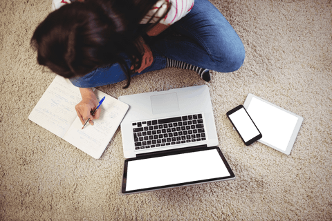 woman sitting on rug with laptop and tablets concept - Download Free Stock Videos Pikwizard.com