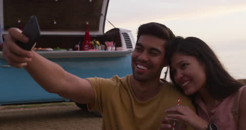 Happy Couple Taking Selfie on Scenic Campervan Adventure
