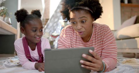 Playful Mother and Daughter Enjoying Tablet Time Together - Download Free Stock Images Pikwizard.com
