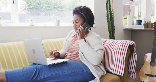 Woman Multitasking on Couch with Laptop and Phone - Download Free Stock Images Pikwizard.com