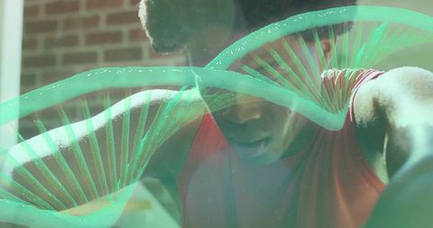 Leaning athlete wearing red tank top stretching behind glass with neon DNA helix overlay