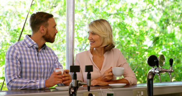 Smiling Couple Enjoys Coffee at Restaurant Patio - Download Free Stock Images Pikwizard.com