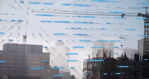 Urban construction through tape-marked glass with tower crane and scaffolding silhouette