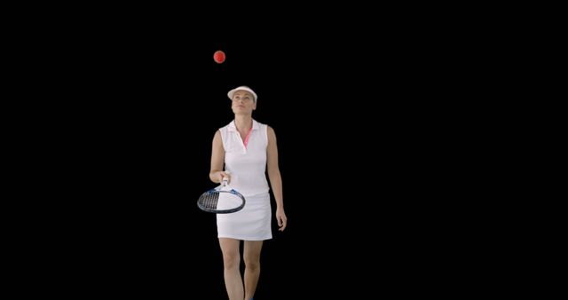A young Caucasian woman dressed in tennis attire is focused on a tennis ball she has just tossed in the air, with copy space. Her poised stance and gaze suggest she is preparing to serve the ball in a match or practice session.