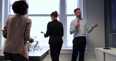 Diverse Team Collaborating in Modern Office Setting with Documents