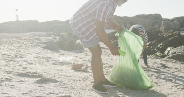 People Cleaning Beach Collecting Trash Outdoors - Download Free Stock Images Pikwizard.com