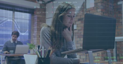 Businesswoman Analyzing Stock Market Data on Laptop in Modern Office - Download Free Stock Images Pikwizard.com