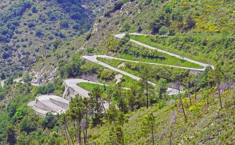 Winding Mountain Road through Lush Green Hillside