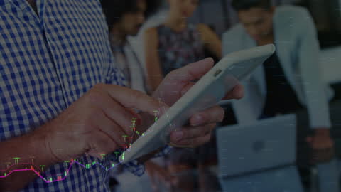 Business Team Analyzing Financial Data on Tablet Device