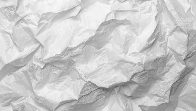 Crumpled white paper texture with artistic creases