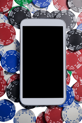 mobile phone displaying blank screen on a pile of poker chips - Download Free Stock Videos Pikwizard.com