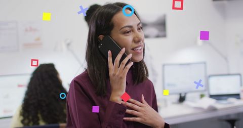 Businesswoman Discussing on Phone in Modern Office