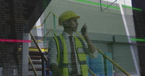 Engineer with mobile at construction site overlays engineering code