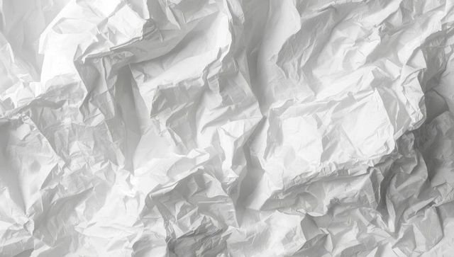 Crumpled white paper art with textured wrinkles